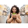 Cheerful,Young,African,Woman,Wearing,Coat,Walking,Outdoors,,Holding,Takeaway
