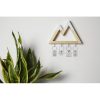 Wooden,Key,Holder,On,Light,Wall,Indoors
