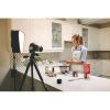 Young,Woman,Wearing,Apron,Filming,Herself,Preparing,Cake,In,The